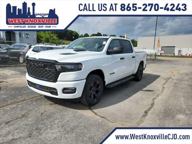 2026 RAM 1500 RAM 1500 EXPRESS CREW CAB 4X4 5'7' BOX in Bright White Clear-Coat Exterior Paint — front three-quarter view