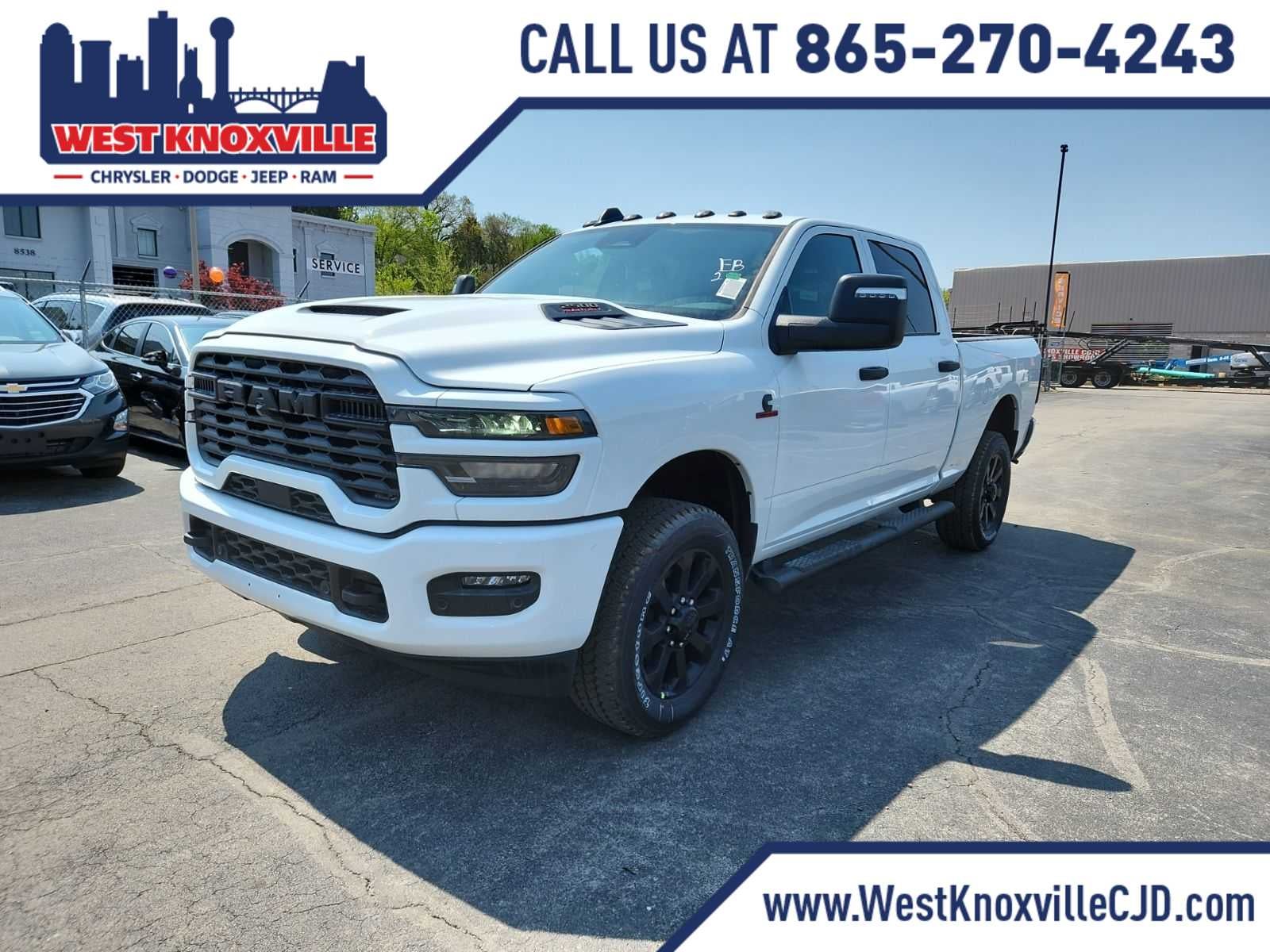 2026 RAM 2500 RAM 2500 BLACK EXPRESS CREW CAB 4X4 6'4' BOX in Bright White Clear-Coat Exterior Paint — front three-quarter view
